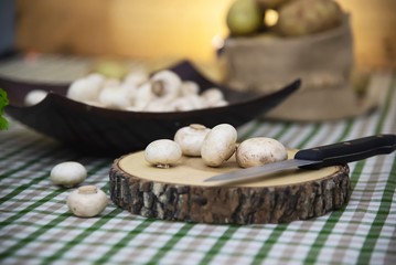 Fototapeta na wymiar Fresh champignon mushroom vegetable in the kitchen - fresh mushroom vegetable cooking concept
