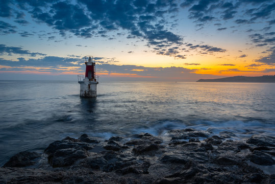Lighthouse at the entrance of San Vicente de la Barquera harbor, Cantabria, Spain