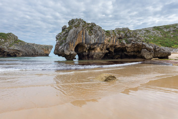 Fototapeta na wymiar Natural arch of Cuevas del Mar beach, Asturias, Spain