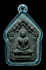 thai amulet on black background.