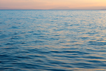 Fototapeta premium Blue clear water. Beautiful blue sea wave photograph close up. Beach vacation at sea or ocean.
