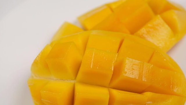 Rotation of fresh Thai yellow mango. Tropical fruit close up.	