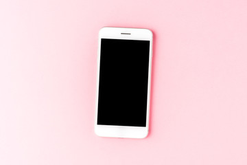 Smartphone on pink background with empty screen