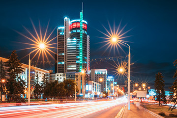 Fototapeta na wymiar Minsk, Belarus. Night Traffic On Illuminated Street Pobediteley Avenue In Minsk