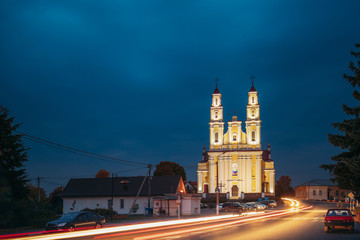 Fototapeta na wymiar Hlybokaye Or Glubokoye, Vitebsk Region, Belarus. Church Of Sts. Trinity In Evening Night Lighting Illuminations