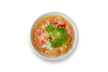 Top view Thai seafood dipping sauce in white bowl. Make from garlic, red chilli, fish sauce, salt, sugar, lime juice and coriander topping isolated and white background, clipping path.