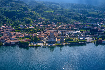 Fototapeta na wymiar Flying over lake Iseo north of Italy. Panoramic view of the alps. A good place to rest in travel.