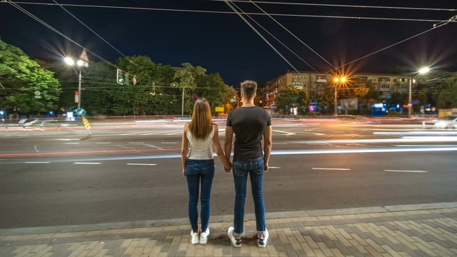 The man and woman walking in the park. evening night time, hyperlapse