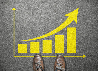 businessman shoes step to rising graph on road, business concept