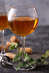 Two glasses with white wine on a textural background. Copy space. Place for your text.