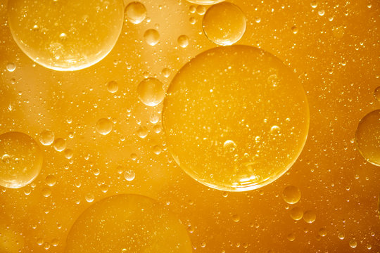 golden yellow bubble oil droplet, abstract background
