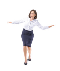 Balancing young businesswoman on white background