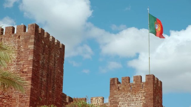 Close-up of the Castle of Silves, in The Algarve, Portugal, with its distinctive red sandstone and history dating back to 201 BC