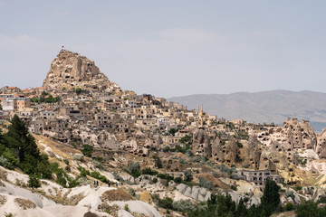 Fototapeta na wymiar Uchisar castle, highest point of Cappadocia in summer season, central Anatolia