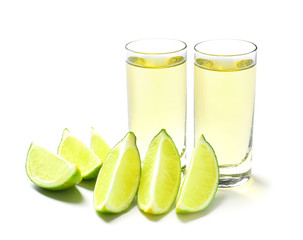 Shots of tequila on white background