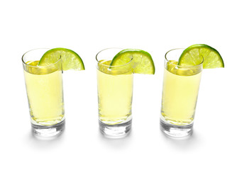 Shots of tequila on white background
