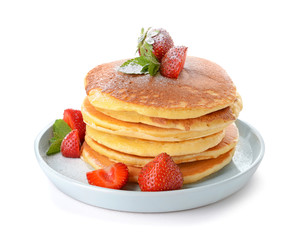 Plate with tasty pancakes and strawberry on white background