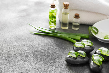 Spa composition with aloe vera on grey background