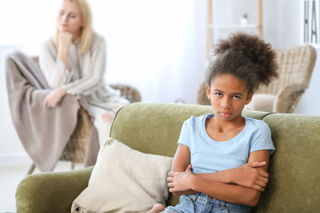 Offended African-American girl after quarrel with mother at home