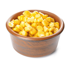 Bowl with corn kernels on white background