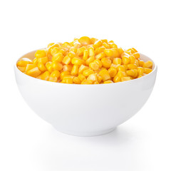 Bowl with corn kernels on white background