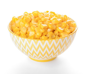 Bowl with corn kernels on white background