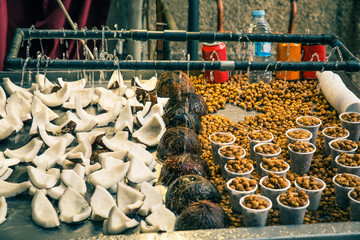 street food stall with  coconuts and  tiger nuts in a fair
