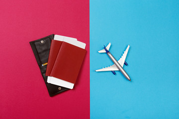 top view photo of toy airplane over color  background . travel concept .
