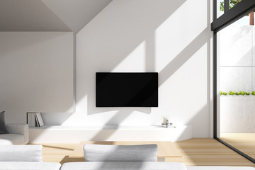 3D Rendering : illustration of modern television hanging on wall in big living room. LED SMART TV hanging with clipping path. front of soft couch sofa. hard light shining into the house. daylight.