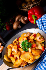 a delicious fried potato and shrimp pan