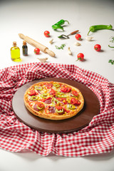 Delicious Pizza with Green Pepper, Salami and Tomatoes