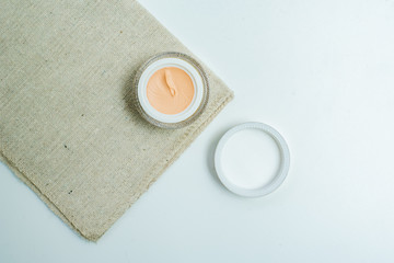 cosmetic product on towel isolated on white, cosmetic product