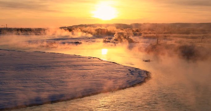 Sunrise over Tokachi river seen in winter, Makubetsu, Hokkaido
