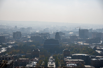 view of the city of Yerevan from the observation deck on a sunny day with clouds in the sky.