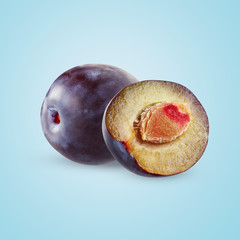 plums  on blue background