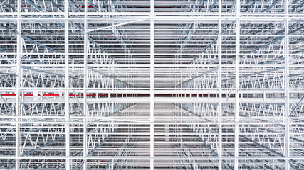Obraz premium Aerial top view structure of steel building construction, Metal steel frame buildings construction design, Aerial view construction site.
