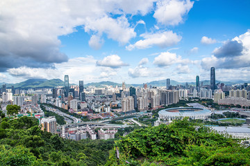 Fototapeta na wymiar Bijiashan Park Peak Observation Deck overlooking Shenzhen city scenery aerial view