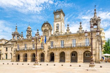 Fototapeta na wymiar View at the City hall building with Clock tower from Mayor place in Lugo - Spain