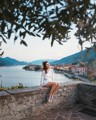 Fototapeta na wymiar An happy girl in Gravedona city on Lake Como