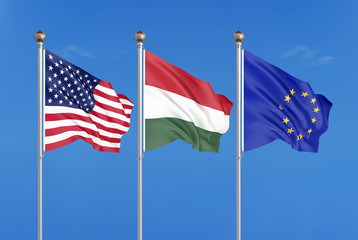 Three colored silky flags in the wind: USA (United States of America), EU (European Union) and Hungary. 3D illustration.