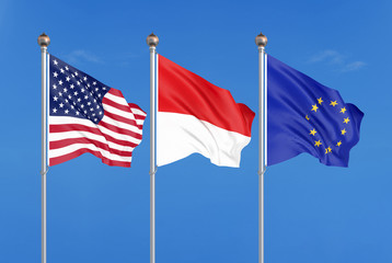 Three colored silky flags in the wind: USA (United States of America), EU (European Union) and Indonesia. 3D illustration.