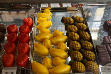 Delicious slices with chocolate, orange, mango, cookies and cream citrus caramel flavor sweet dessert in bakery assorted creamy flavor confectionery famous in New Zealand Queenstown on shelf 