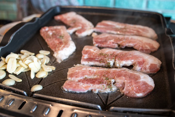 Korean style barbeque Samgyeopsal with garlic