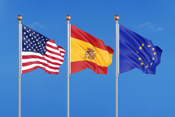 Three colored silky flags in the wind: USA (United States of America), EU (European Union) and Spain. 3D illustration.
