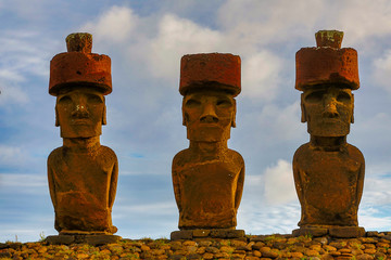 Moai on Easter Island with red topknot hats at Anakena Ahu.