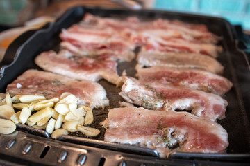 Korean style barbeque Samgyeopsal with garlic