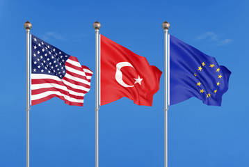 Three colored silky flags in the wind: USA (United States of America), EU (European Union) and Turkey. 3D illustration.
