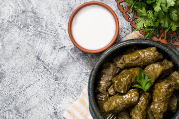 Traditional dolma  (sarma) in grape leaves with copyspace. Lebanon turkish greek middle eastern cuisine. Dinner food dolmadakia