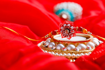 Raksha bandhan rakhi on red background