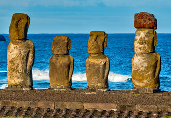 Moai on Easter Island with red topknot hats at Anakena Ahu.